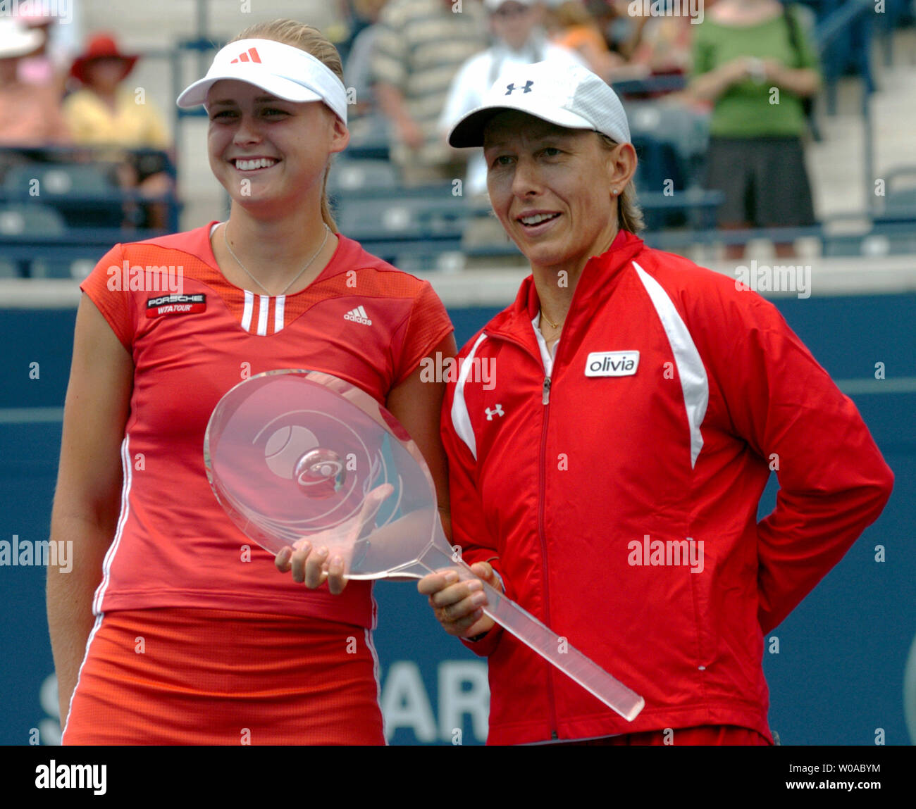 Tennis legend Martina Navratilova(right) and Anna-Lena Groenefeld pose with their trophy after defeating Conchita Martinez and Virginia Ruano Pascual in the doubles final at the Rogers Cup tournament at the Rexall Center August 21, 2005 in Toronto, Canada. Navratilova and Groenefeld rallied from a set down to win the match 5-7, 6-3, 6-4. (UPI Photo/Christine Chew) Stock Photo