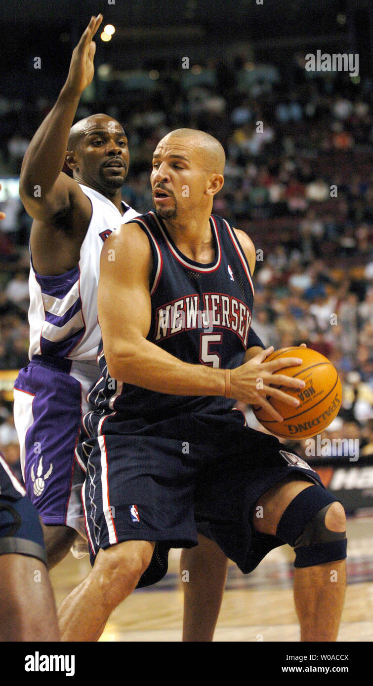New Jersey Nets' Jason Kidd looks for a teammate to pass to asToronto  Raptors' Mike James guards him during first quarter action at the Air  Canada Center on November 4, 2005 in