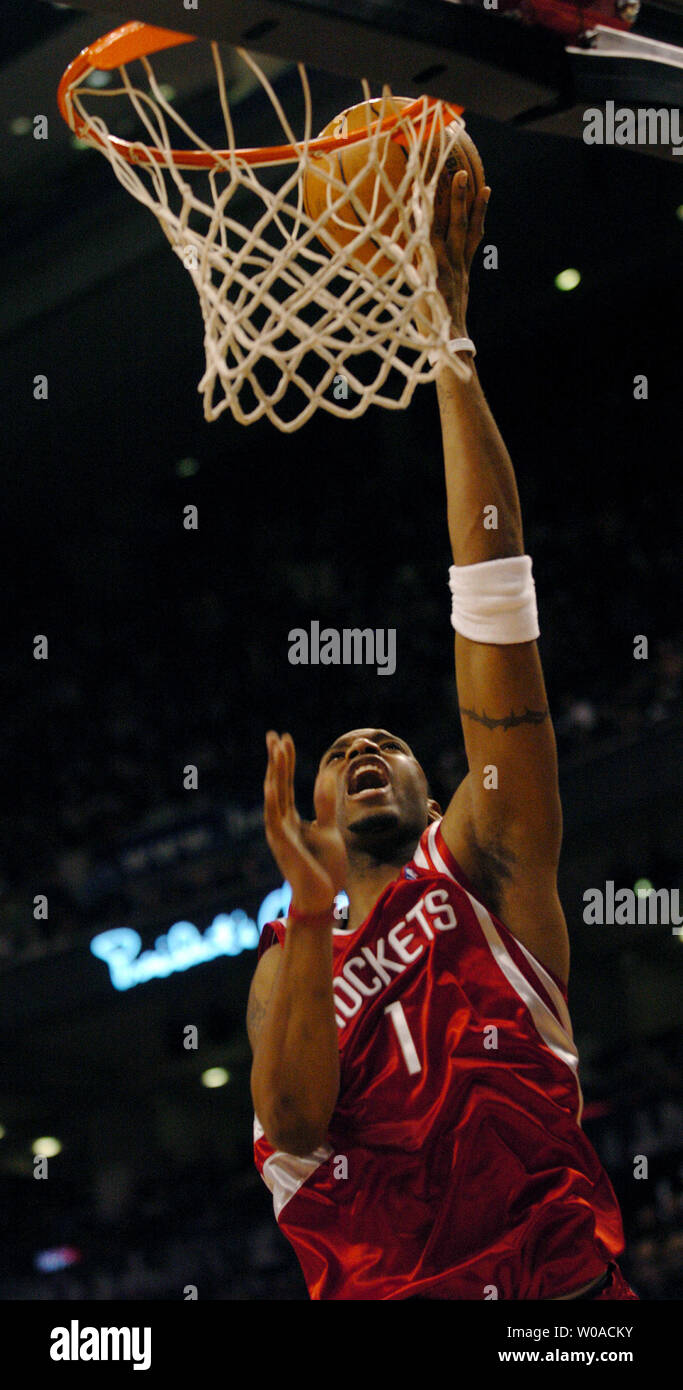 Houston Rockets' Tracy McGrady goes to the hoop for a layup during second quarter action as the Toronto Raptors host the Rockets at the Air Canada Center on January 6, 2006 in Toronto, Canada. McGrady led all scorers with 37 points on the night but the Raptors defeated the Rockets 112-92. (UPI Photo/Christine Chew) Stock Photo