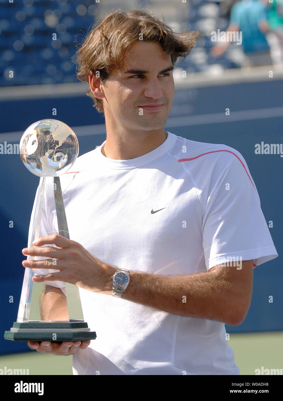 Roger Federer holds the Rogers Cup championship trophy after his victory  over Richard Gasquet in the singles final at the Rexall Center in Toronto,  Canada on August 13, 2006. Federer, the tournament