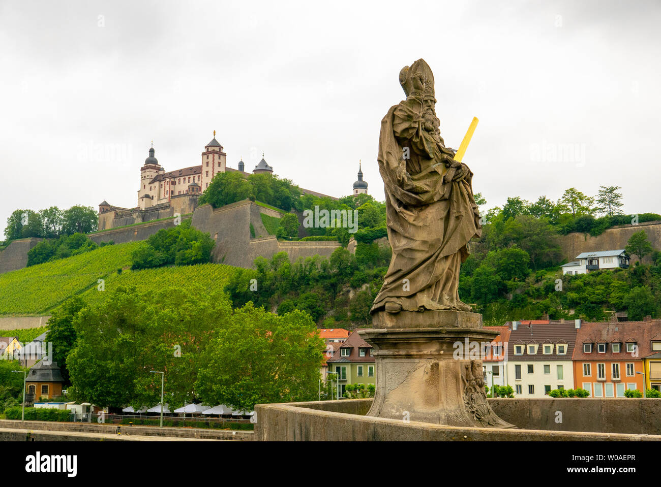 WURZBURG, GERMANY - JUNE 12, 2019: The statue of St Kilian in a the alte Mainbrucke, the old bridge across the Main river in Wurzburg - Bavaria, Germa Stock Photo
