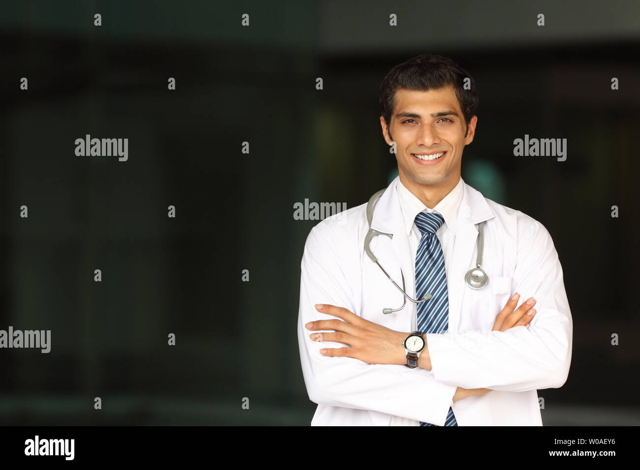Portrait of a male doctor smiling Stock Photo - Alamy