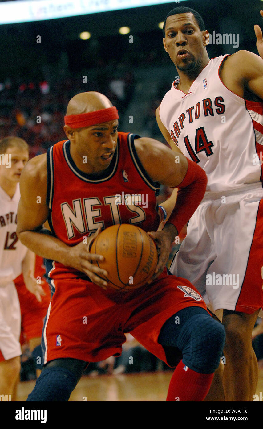 New Jersey Nets' Vince Carter hunkers down as Toronto Raptors' Jalen Rose  keeps an eye on him during third quarter action at the Air Canada Center  April 15, 2005 in Toronto, Canada.