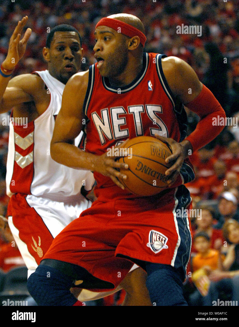 New Jersey Nets' Vince Carter takes aim at the basket during second quarter  action against his former team the Toronto Raptors at the Air Canada Center  on January 8, 2006 in Toronto