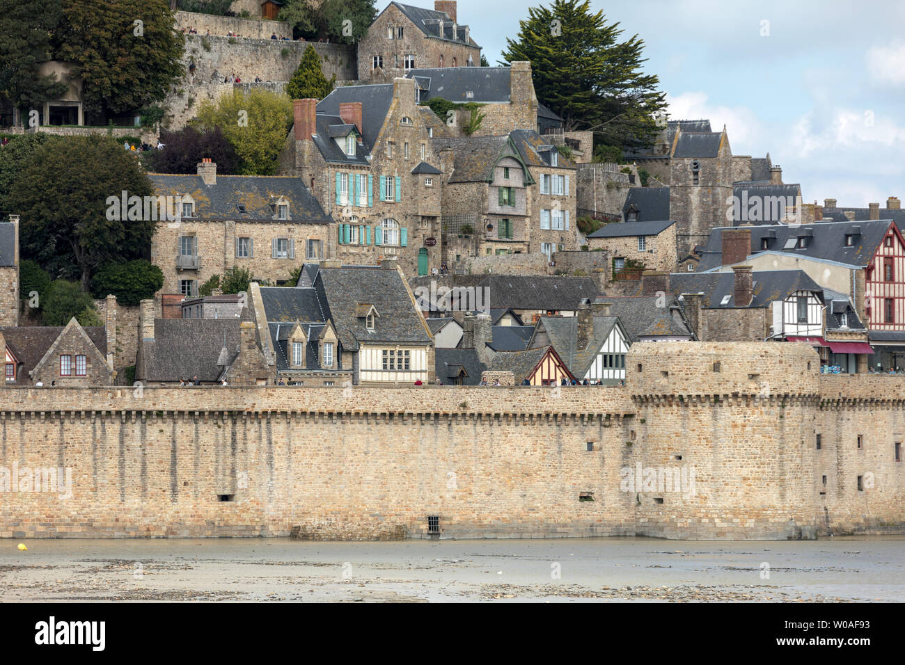 Le Mont Saint-Michel, medieval fortified abbey and village on a tidal island in the Normandy, France, at low tide Stock Photo