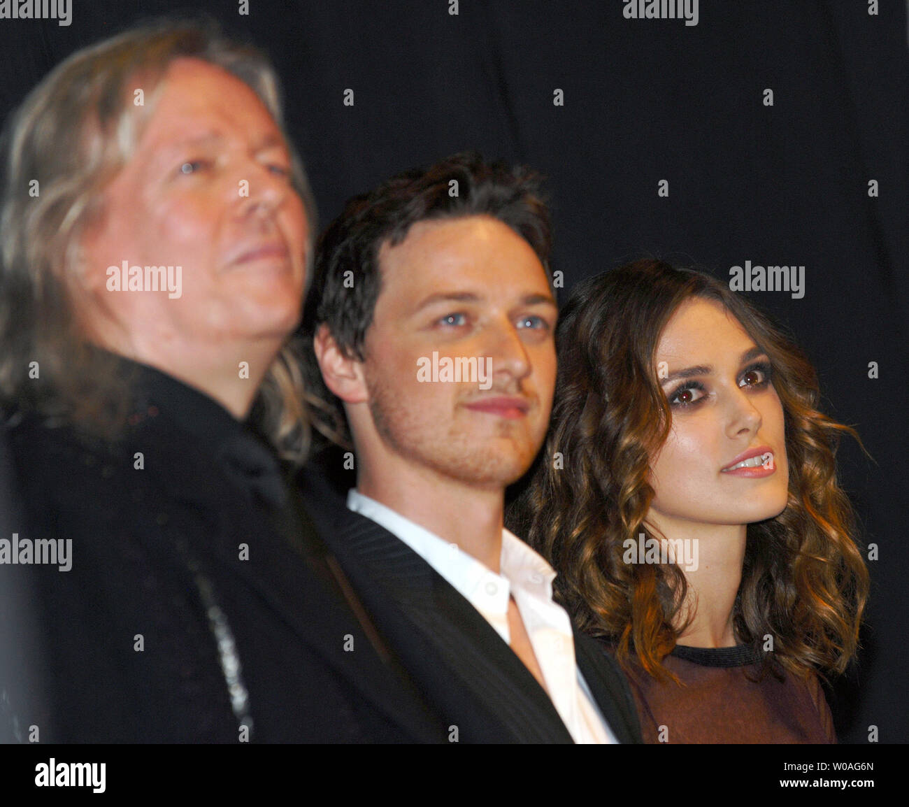 (R-L) Keira Knightley, James McAvoy and screenplay writer Christopher Hampton listen as director Joe Wright introduces the cast onstage at the Toronto International Film Festival premiere of 'Atonement' at the Elgin Theater in Toronto, Canada on September 10, 2007. (UPI Photo/Christine Chew) Stock Photo