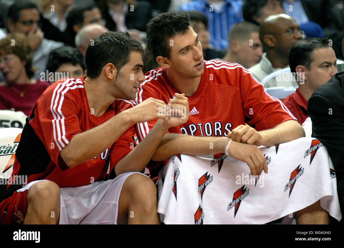 Toronto Raptors Jose Calderon (L) of Spain gives teammate Andrea Bargnani of Italy some pointers as they watch the game from the bench during second quarter action against the Philadelphia 76ers in