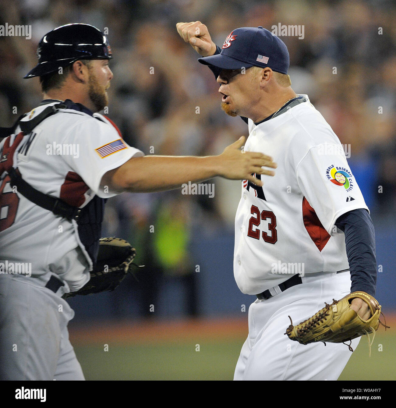 Team USA pitcher J.J. Putz (R) and catcher Brian McCann celebrate at the  bottom of the ninth as their team defeated Team Canada 6-5 in Round 1 of  the World Baseball Classic