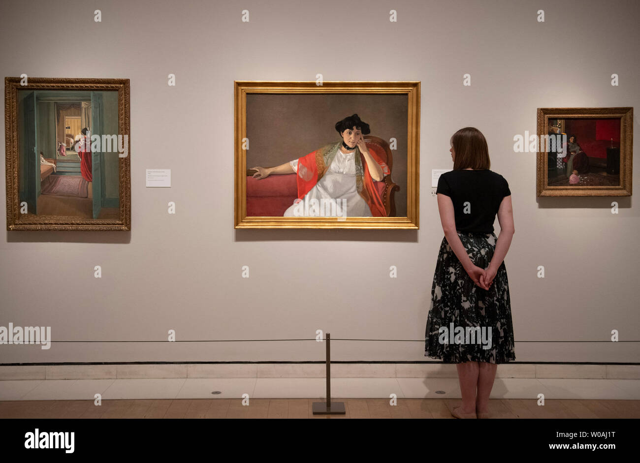 Royal Academy of Arts, London, UK. 27th June 2019. Felix Vallotton: Painter of Disquiet. The first exhibition of the artist Felix Vallotton’s work in the UK since 1976 and the first to include his paintings. Image: (left) Interior with Woman in Red (Intérieur avec femme en rouge de dos), 1903. Oil on canvas. 92.5 x 70.5 cm. Kunsthaus Zürich; (right) Gabrielle Vallotton, 1905. Musée des Beaux-Arts, Bordeaux. Credit: Malcolm Park/Alamy Live News. Stock Photo