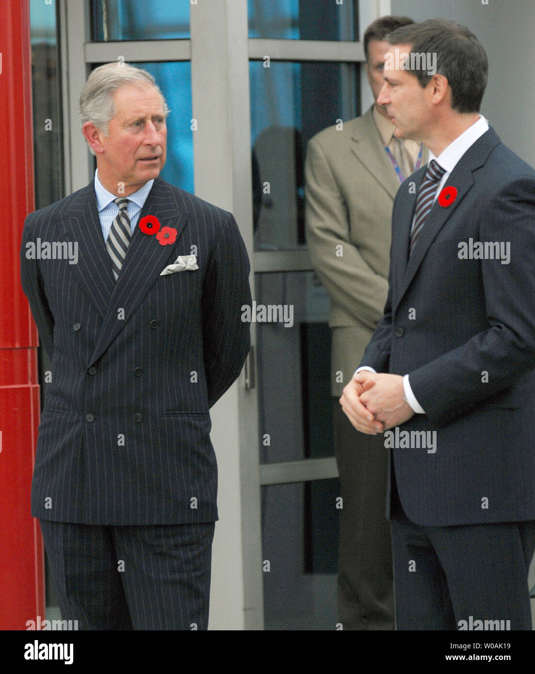 Britain's Prince Charles (R) and Ontario premier Dalton McGuinty chat as the Prince and his wife Camilla, Duchess of Cornwall, arrive at Pearson International Airport in Toronto, Canada on November 4, 2009.  The royal couple are on an 11-day tour of Canada.  UPI /Christine Chew Stock Photo