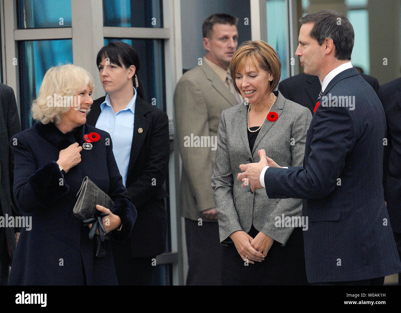 Camilla Parker Bowles, Duchess of Cornwall (L), chats with Ontario premier Dalton McGuinty (R) and his wife Terri at Pearson International Airport in Toronto, Canada on November 4, 2009.  The Duchess and her husband Prince Charles are on an 11-day tour of Canada.  UPI /Christine Chew Stock Photo