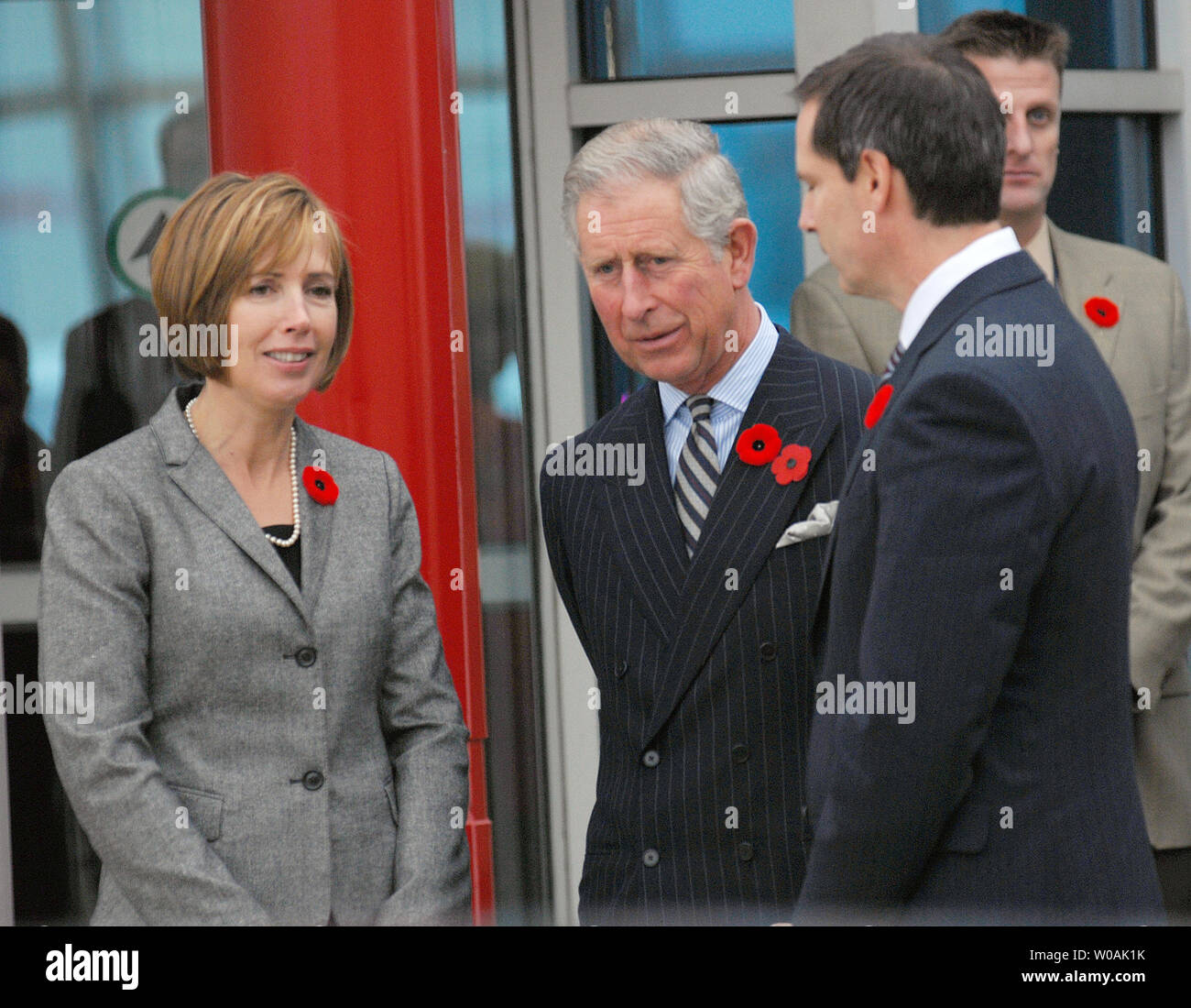 Britain's Prince Charles (center) chats with Ontario premier Dalton McGuinty (R) and his wife Terri at Pearson International Airport in Toronto, Canada on November 4, 2009.  Prince Charles and his wife Camilla, Duchess of Cornwall, arrived in Toronto today and are on an 11-day tour of Canada.  UPI /Christine Chew Stock Photo