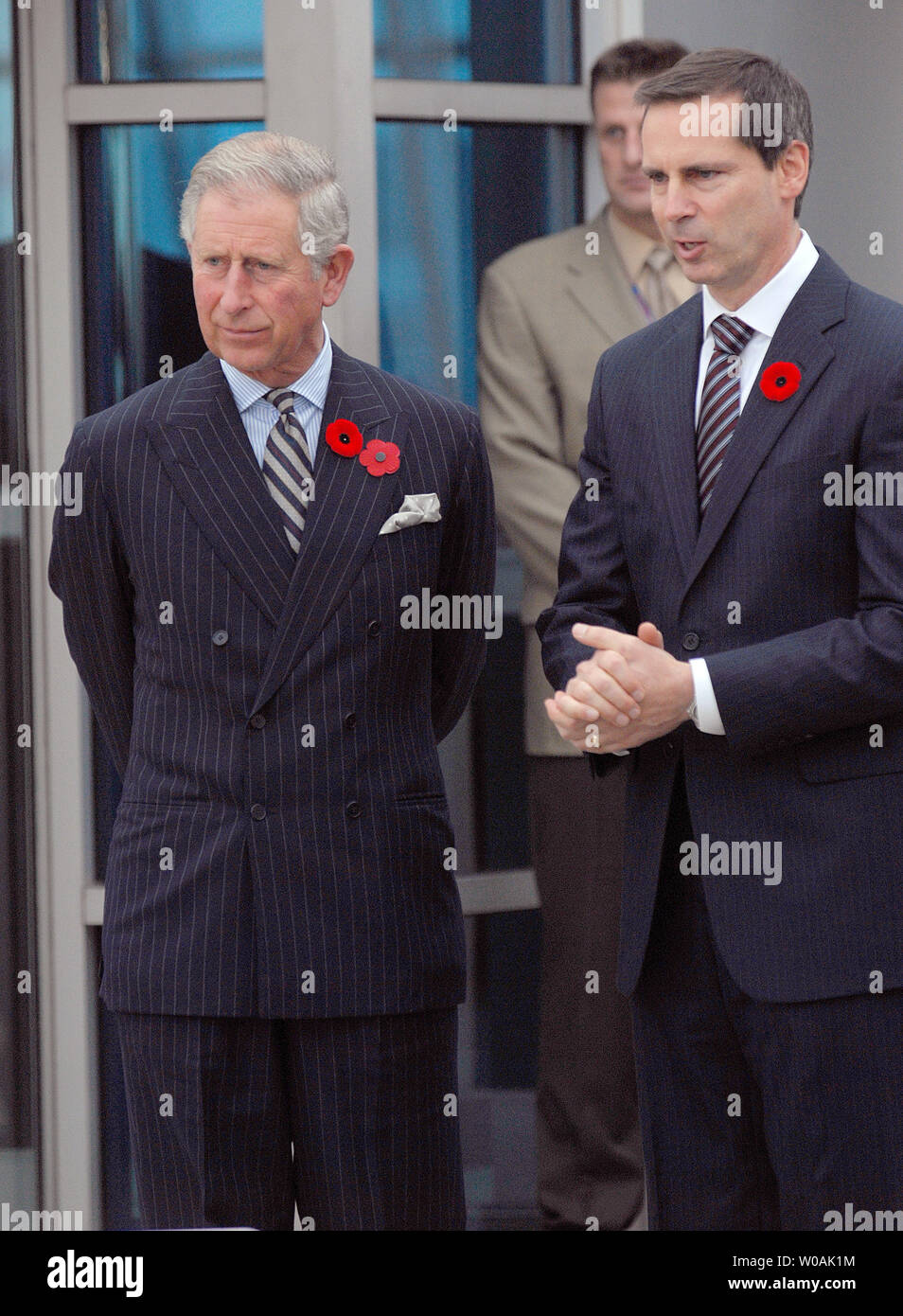 Britain's Prince Charles (R) and Ontario premier Dalton McGuinty chat as the Prince and his wife Camilla, Duchess of Cornwall, arrive at Pearson International Airport in Toronto, Canada on November 4, 2009.  The royal couple are on an 11-day tour of Canada.  UPI /Christine Chew Stock Photo