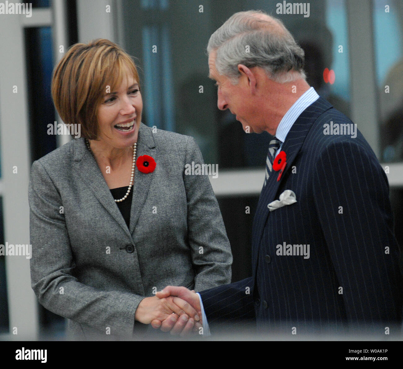 Britain's Prince Charles (R) shakes hands with Terri McGuinty, wife of Ontario premier Dalton McGuinty, at Pearson International Airport in Toronto, Canada on November 4, 2009.  The Prince and his wife Camilla, Duchess of Cornwall, arrived in Toronto today as part of their 11-day tour of Canada.  UPI /Christine Chew Stock Photo