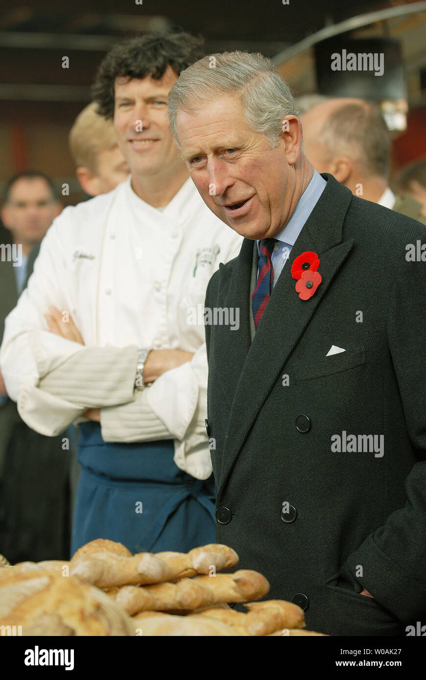 Britain's Prince Charles (R), escorted by chef Jamie Kennedy, speaks to food vendors as he tours the Harvest Market at the Heritage Brick Factory Building in Toronto, Canada on November 6, 2009.  The Prince and his wife Camilla, Duchess of Cornwall, are on an 11-day tour of Canada.  UPI /Christine Chew Stock Photo