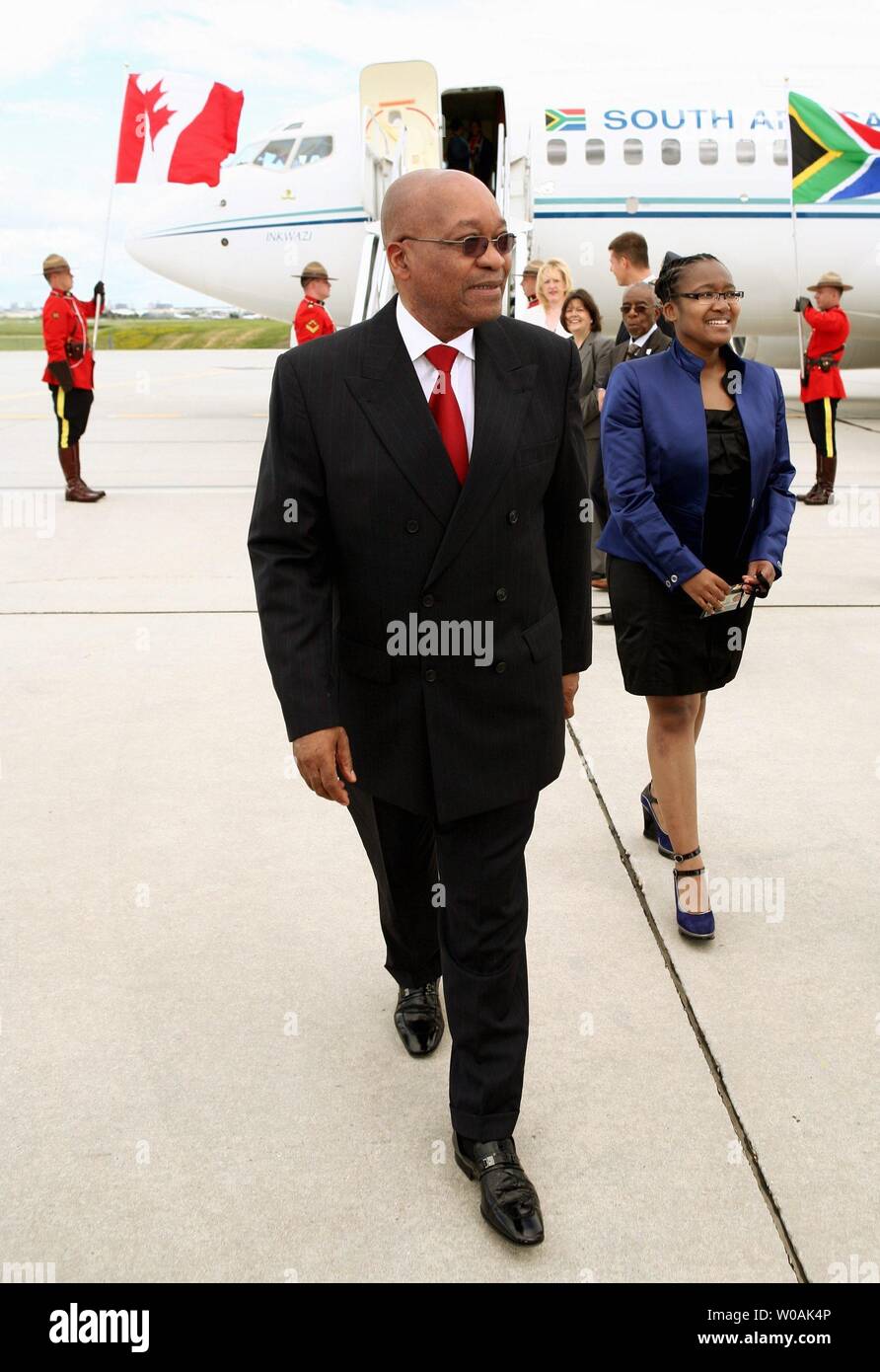 Jacob Gedleyihlekisa Zuma, President of the Republic of South Africa,  arrives with his daughter Phumzile Zuma at Toronto International Airport,  June 24, 2010 to attend the G8, G20 Summits in Huntsville and