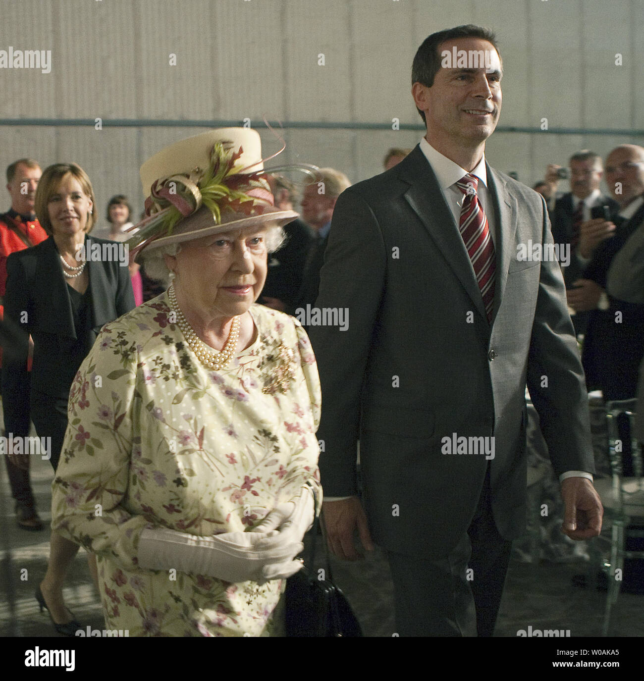 Ontario Premier Dalton McGuinty escorts Great Britain's Queen Elizabeth as she and Prince Philip arrive for the luncheon during their tour of Pinewood Toronto Studios in Toronto, Ontario, July 5, 2010. The Queen and Prince Philip are on day eight of their nine day Royal Tour of Canada.  UPI/Heinz Ruckemann Stock Photo