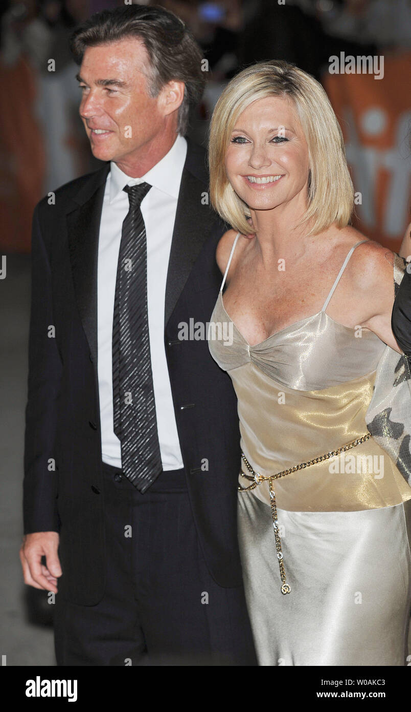 Singer and actor Olivia Newton John and her husband John Easterling arrive for the world premiere gala of 'Score: A Hockey Musical' at Roy Thomson Hall on opening night of the Toronto International Film Festival in Toronto, Canada on September 9, 2010. (UPI Photo/Christine Chew) Stock Photo