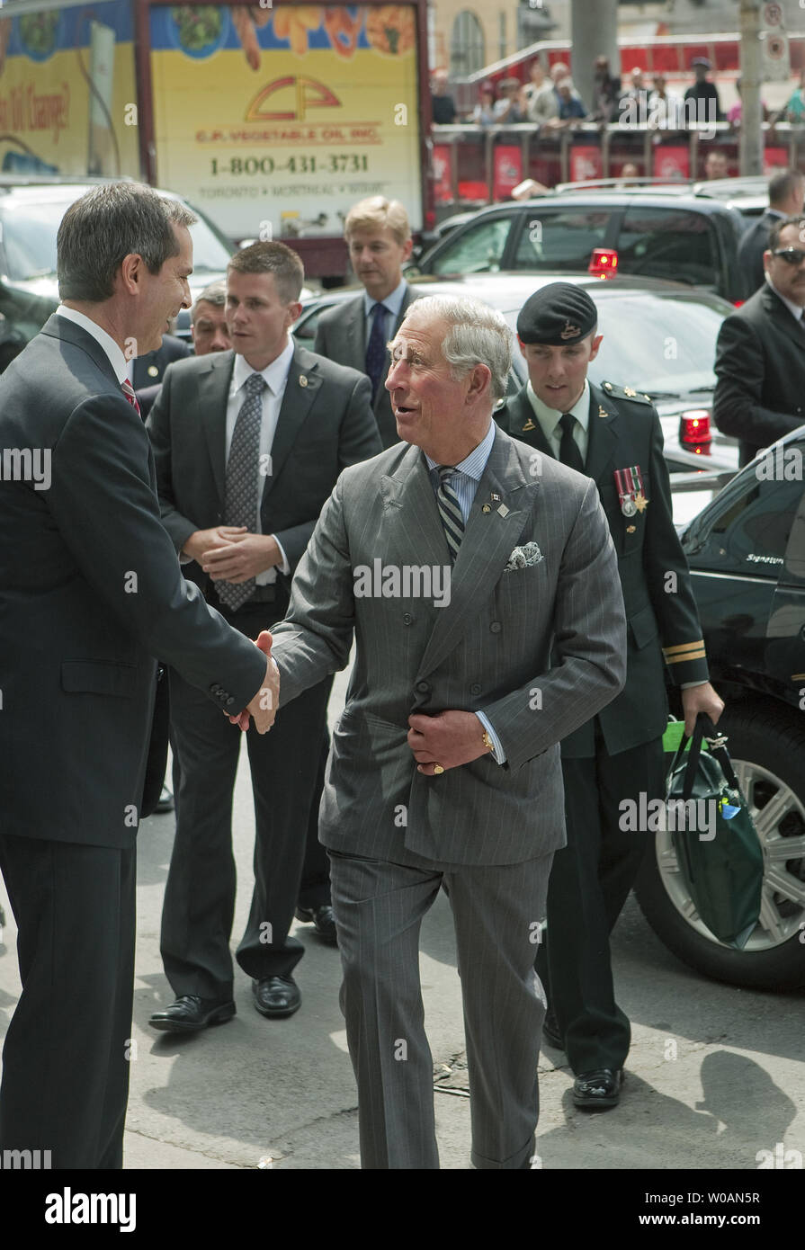 Prince Charles is welcomed by Ontario Premier Dalton McGuinty as he arrives at the Digital Media Zone at Ryerson University in Toronto, Ontario on May 22, 2012 during the second leg of the 2012 Royal Tour to Canada part of Queen Elizabeth's Diamond Jubilee celebrations.     UPI Photo /Heinz Ruckemann Stock Photo