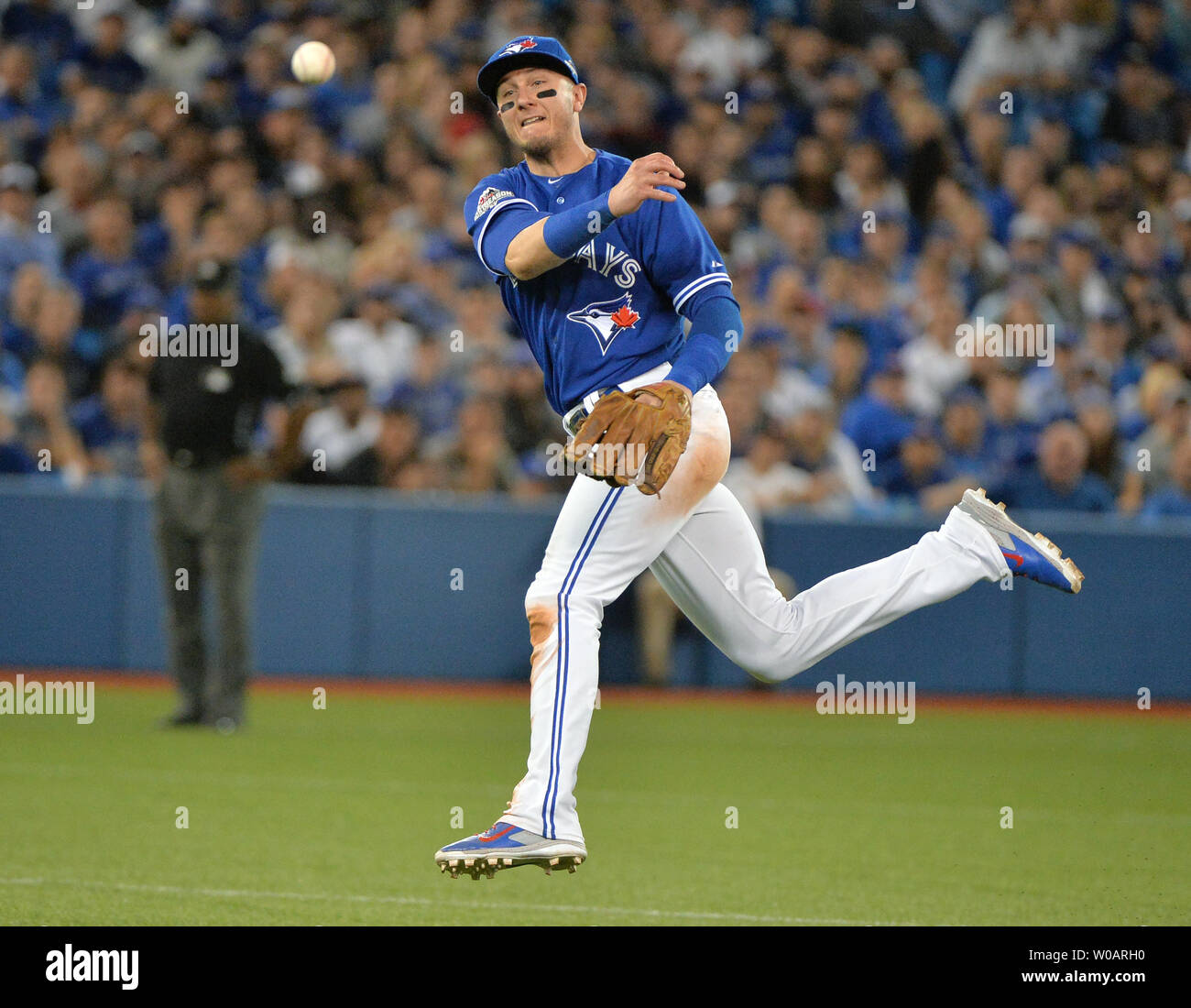 Toronto Blue Jays Shortstop Troy Tulowitzki Tries To Throw Out Kansas City Royals Ben Zobrist During The Eighth Inning In The Alcs Game 4 At The Rogers Centre In Toronto Canada On