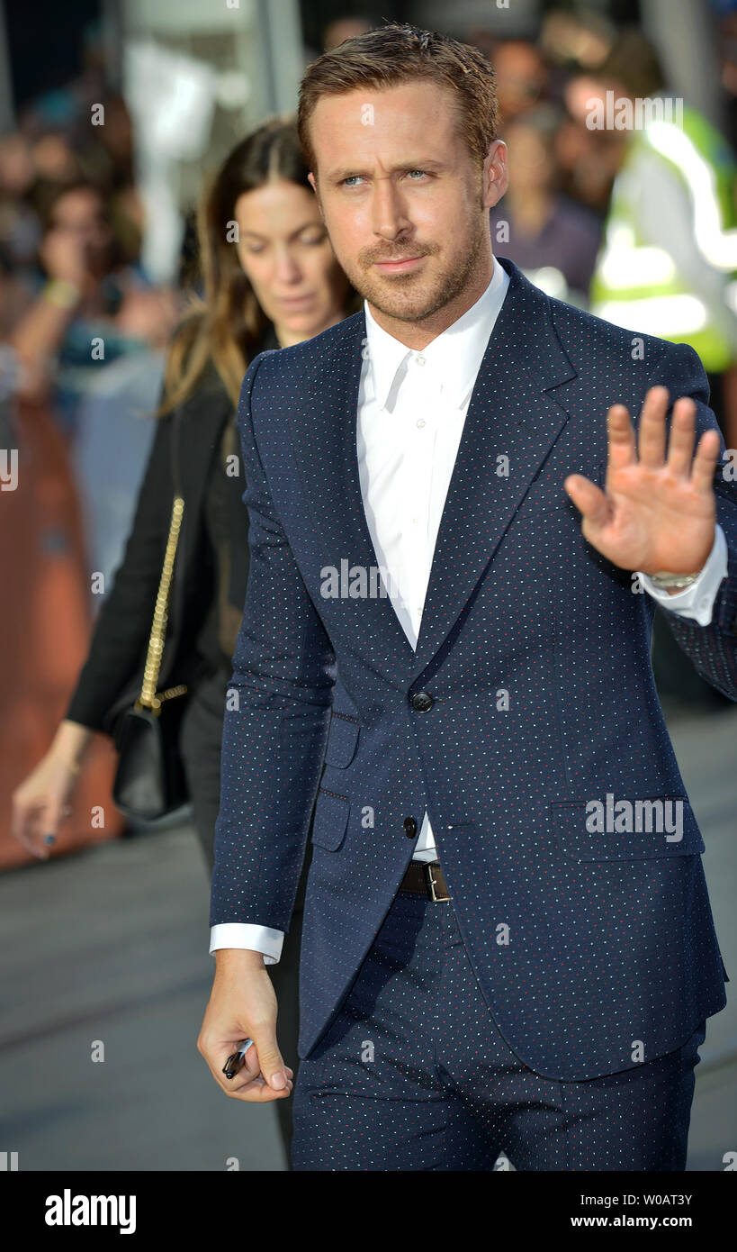Ryan Gosling waves to fans as he arrives at the Toronto International ...