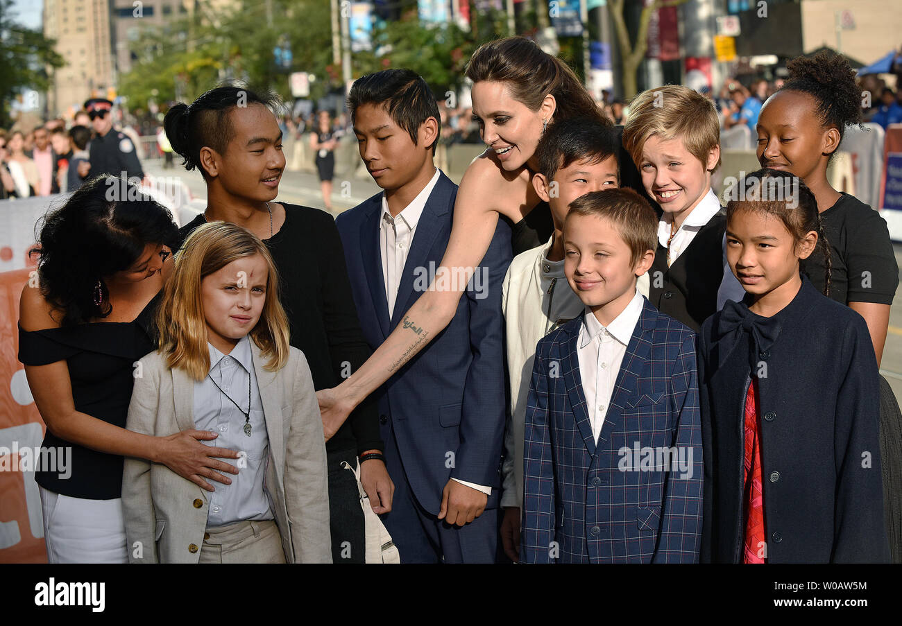 (L-R) Loung Ung, Vivienne Jolie-Pitt, Maddox Jolie-Pitt, Pax Jolie-Pitt, Angelina Jolie, Kimhak Mun, Knox Jolie-Pitt, Shiloh Jolie-Pitt, Sreymoch Sareum and Zahara Jolie-Pitt attend the Toronto International Film Festival premiere of  'First They Killed My Father' at the Princess of Wales Theatre in Toronto, Canada on September 11, 2017. Photo by Christine Chew/UPI Stock Photo