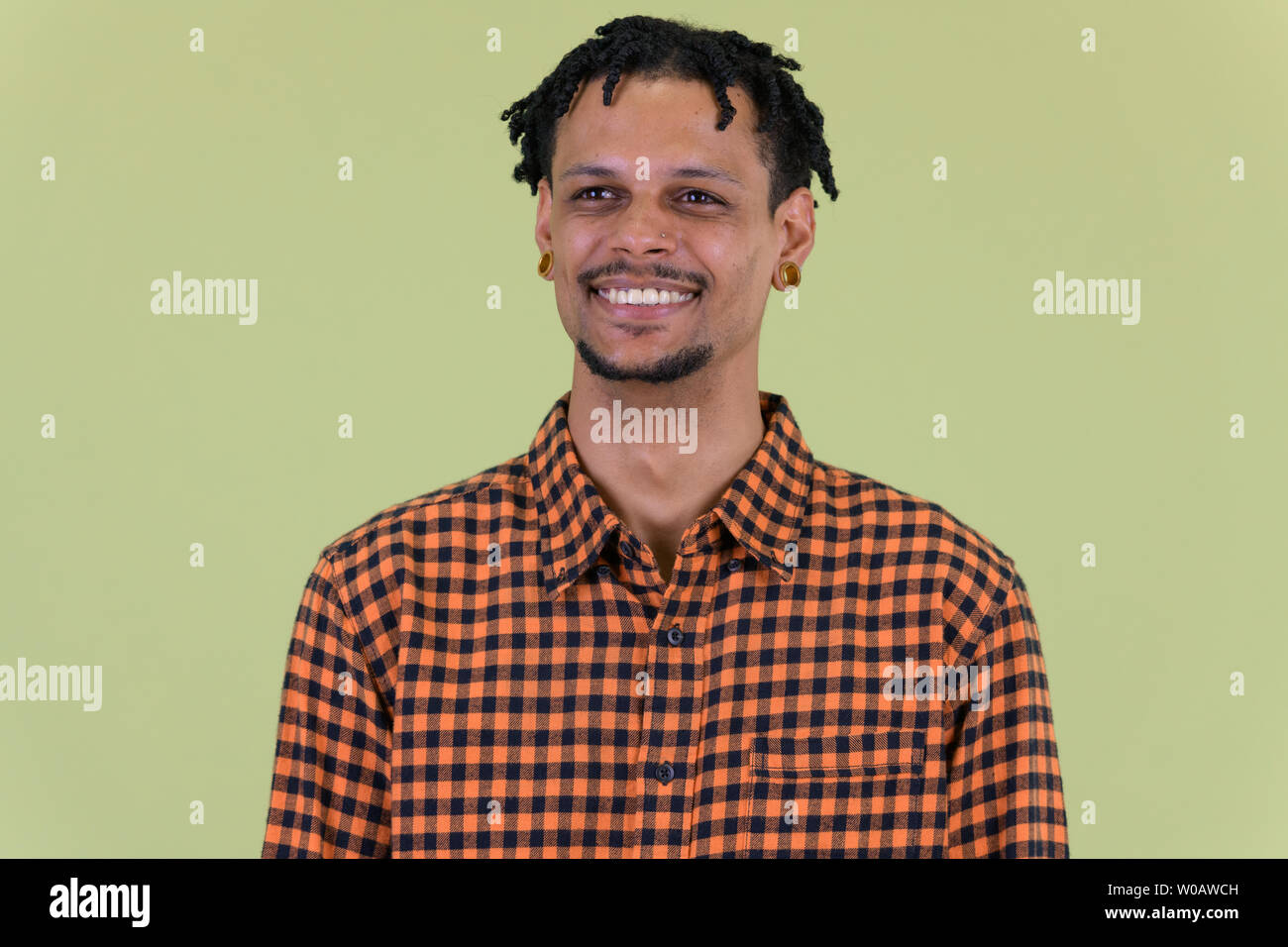 Face of happy young handsome African man thinking Stock Photo - Alamy
