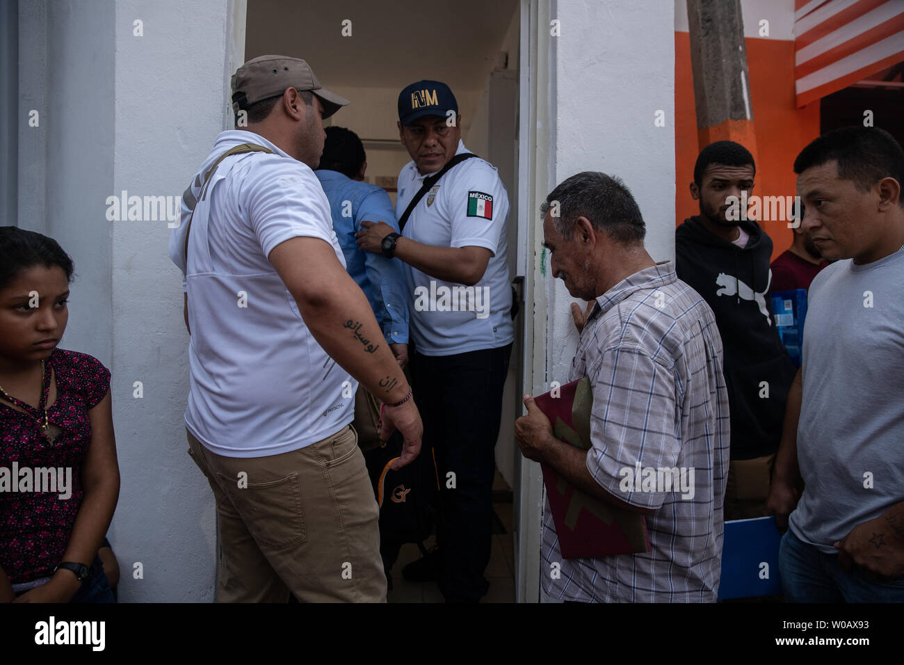 Migrants enter INM's Regional Sub-delegation office in Tapachula, Mexico after their name is called to discuss having the proper paperwork to travel freely in Mexico without fear of deportation on May 6, 2019.   Some migrants enter Mexico at this southern border town and then travel freely north to the United States border.     Photo by Ariana Drehsler/UPI Stock Photo