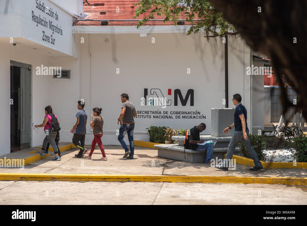 Some of the migrants who have been waiting outside the INM's Regional Sub-delegation office enter the building after their name has been called in Tapachula, Mexico on May 8, 2019.   Many of the migrants hope to apply for an exit visa that is good for twenty days.    Photo by Ariana Drehsler/UPI Stock Photo