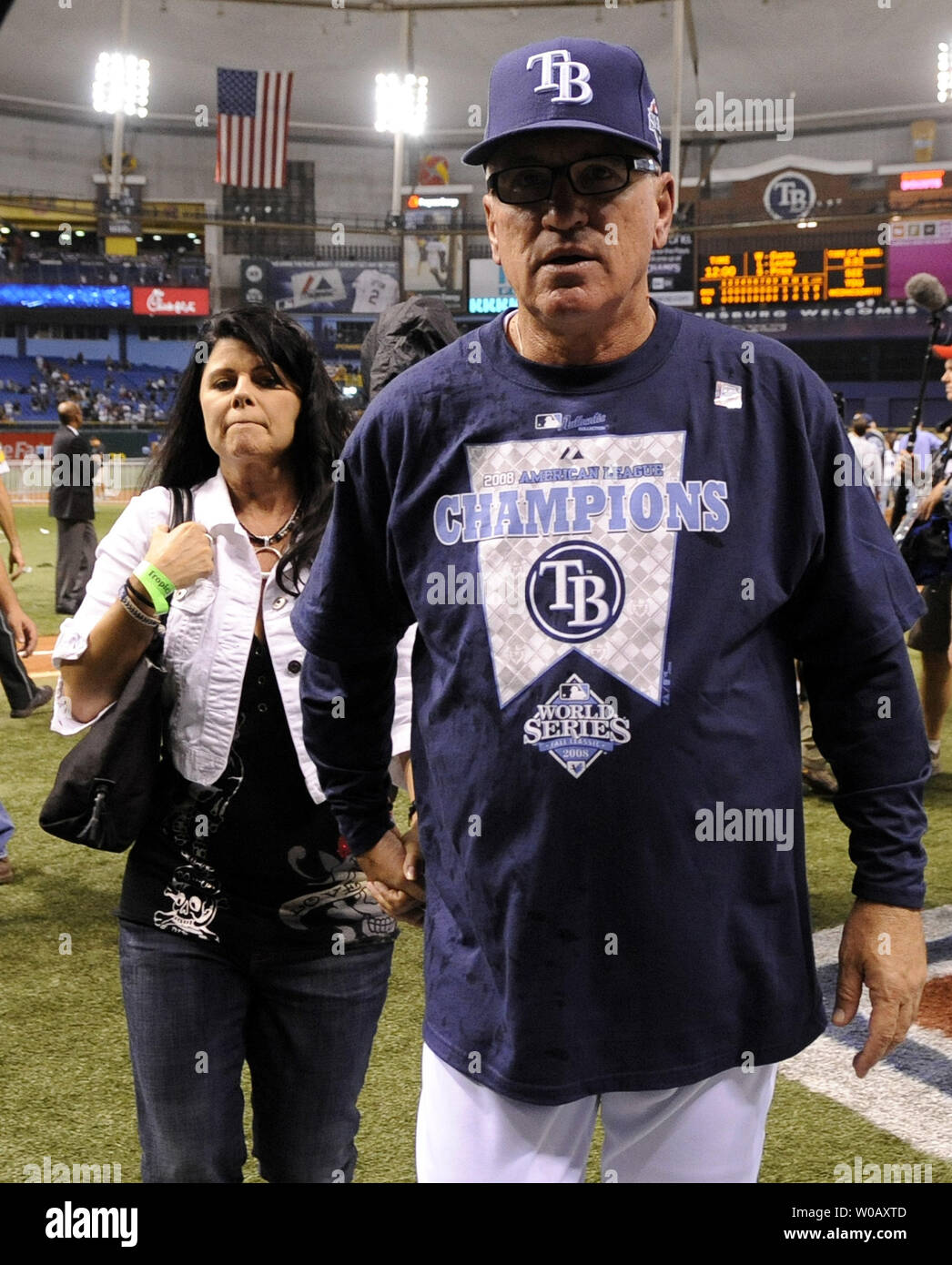Tampa Bay Rays Manager Joe Maddon leaves the field after the Rays defeated  the Boston Red Sox 3-1 to win the American League Championship at Tropicana  Field in St. Petersburg, Florida on