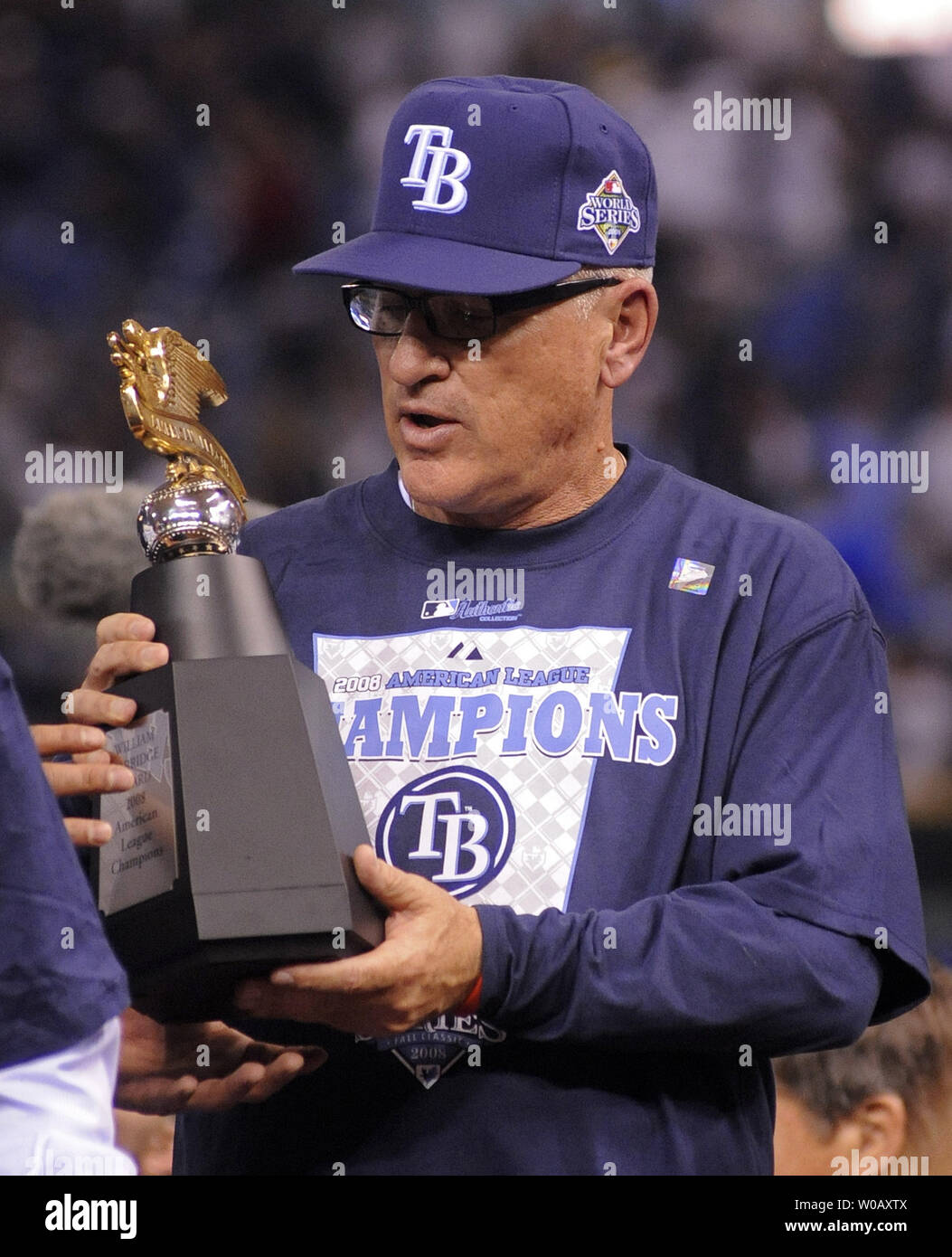 Tampa Bay Rays Manager Joe Maddon leaves the field after the Rays defeated  the Boston Red Sox 3-1 to win the American League Championship at Tropicana  Field in St. Petersburg, Florida on