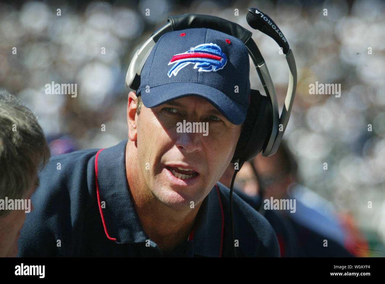 Buffalo Bills Head Coach Mike Mularkey talks with a coach on the sidelines at the Network Associates Coliseum in Oakland, CA, on September 19, 2004.  The Raiders defeated the Bills 13-10.     (UPI Photo/Bruce Gordon) Stock Photo