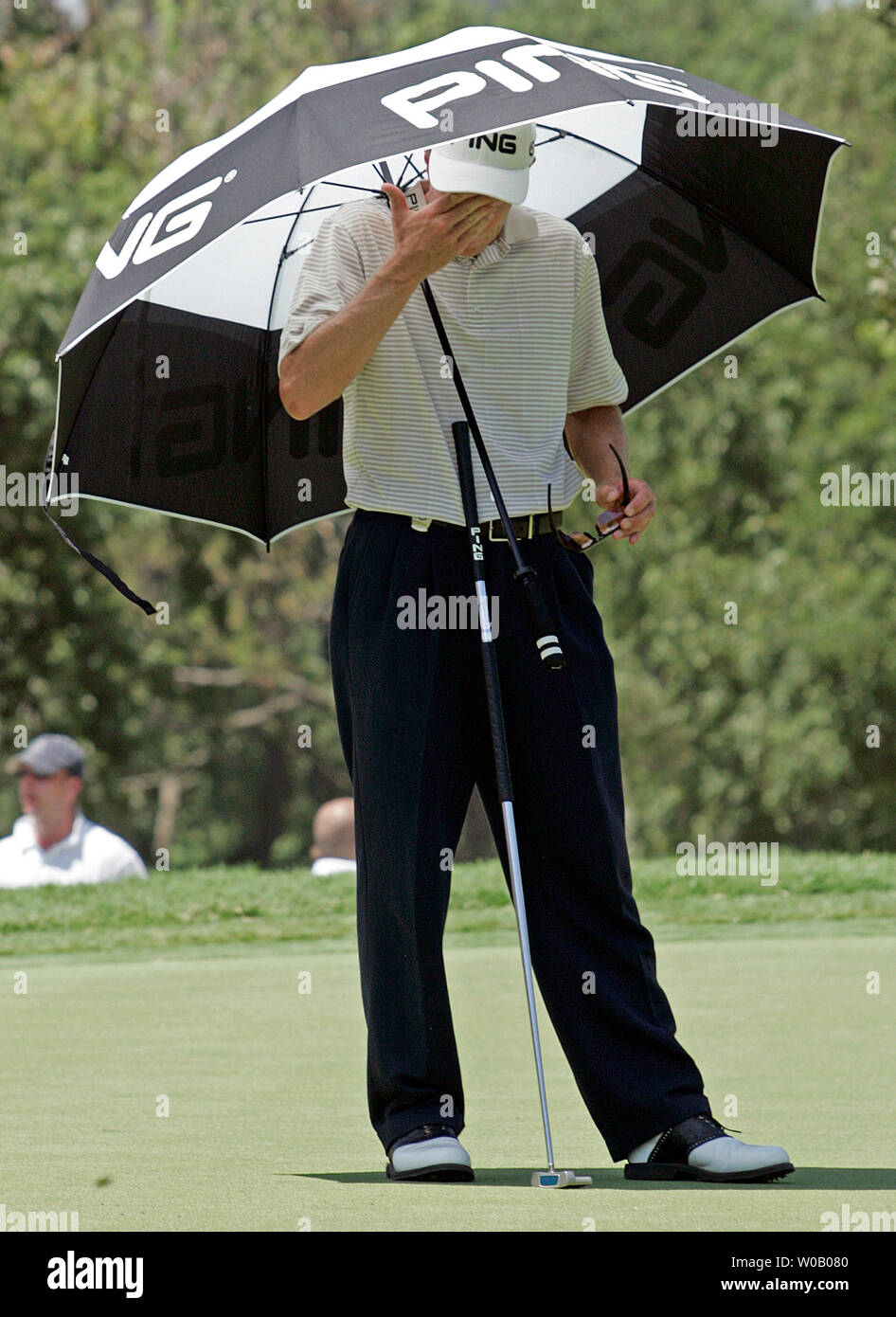Australia's Nick O'Hern wipes the sweat from his face while under his golf umbrella as the heat approaches 100 degrees during the first round at the 89th PGA Championship at Southern Hills Country Club in Tulsa, Oklahoma on August 9, 2007.   (UPI Photo/Gary C. Caskey Stock Photo