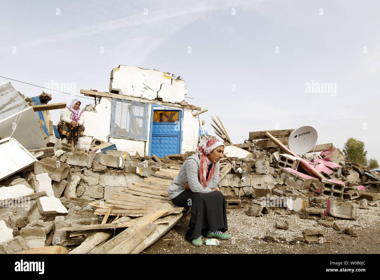 Aysel sits in front of her house in Guveali Koyu on October 26, 2011, near Ecris, Turkey.  Three days after 7.2 magnitude earthquake struck Turkey killing at least 400 and injuring more than a 1,000, rescue workers are still searching for survivors.      UPI/Maryam Rahmanian Stock Photo