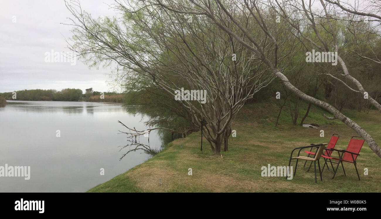 The Rio Grande flows past  a property in Rio Grande City, Texas on March 5, 2019. The grassy riverfront fishing area looking into Mexico and belonging to the Alvarez family would be cut off from their homes if the border wall is built.       Photo by Patrick Timmons/UPI Stock Photo