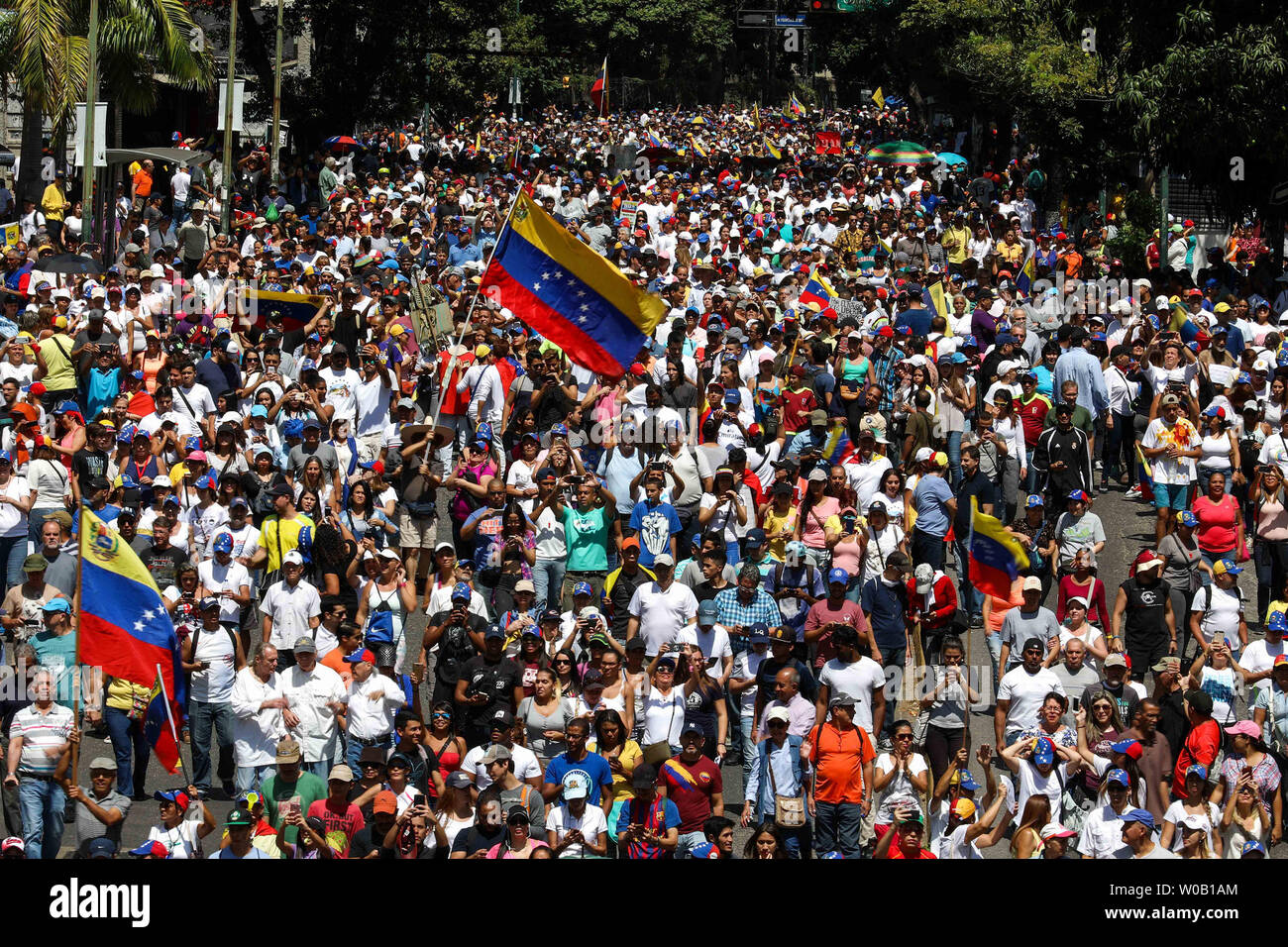 Supporters of Venezuelan opposition leader Juan Guaido gather in Caracas on February 2, 2019. Venezuelan protesters flowed into the streets of Caracas Saturday, with flags and placards, many to support opposition leader Juan Guaido's calls for democratic elections and others to back embattled President Nicolas Maduro.     Photo by Cristian Hernandez/UPI Stock Photo