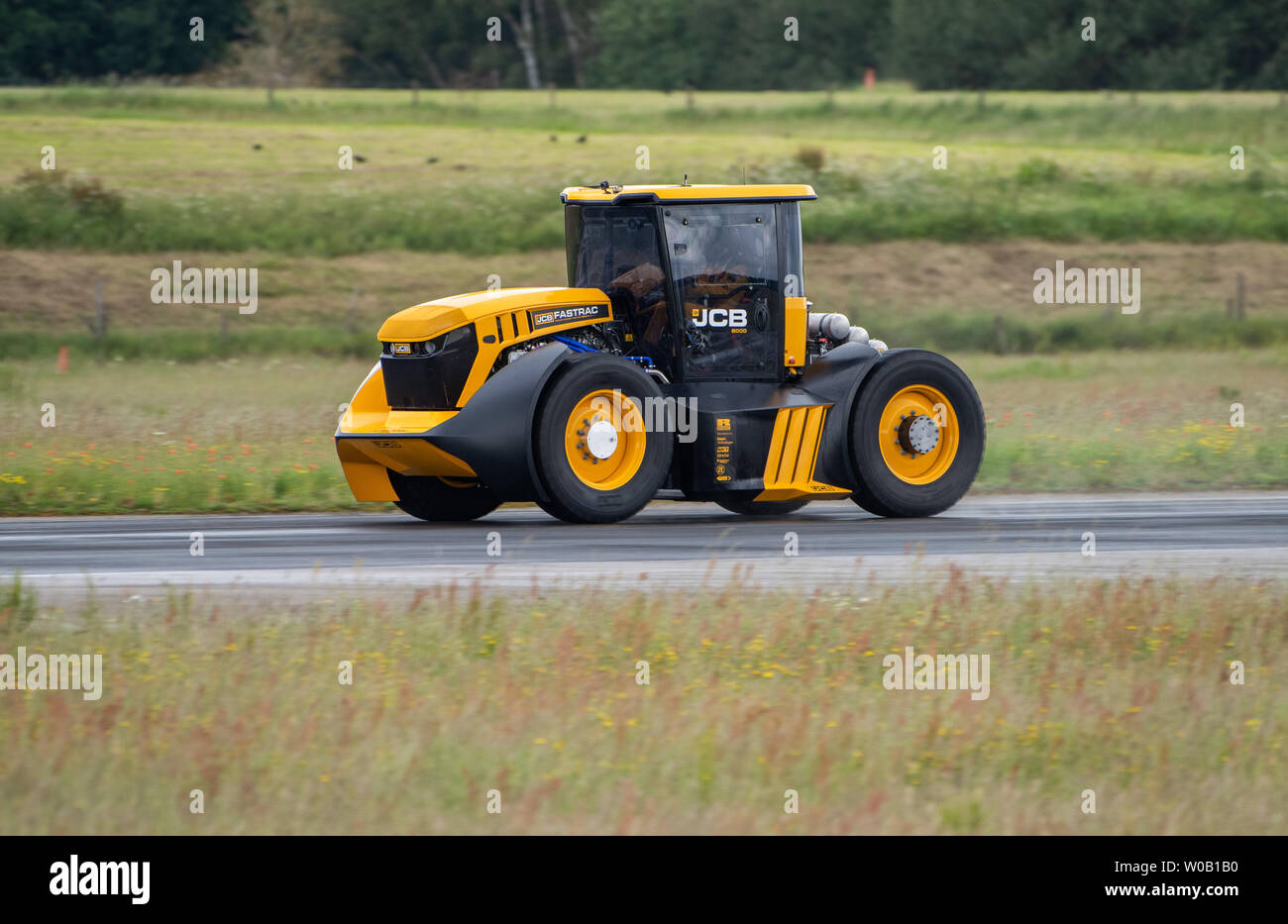 JCB Agri-machinery manufactures making a new British speed record for a tractor of 103.6 mph, beating the previous 87.27 mph record set in March 2018 Stock Photo