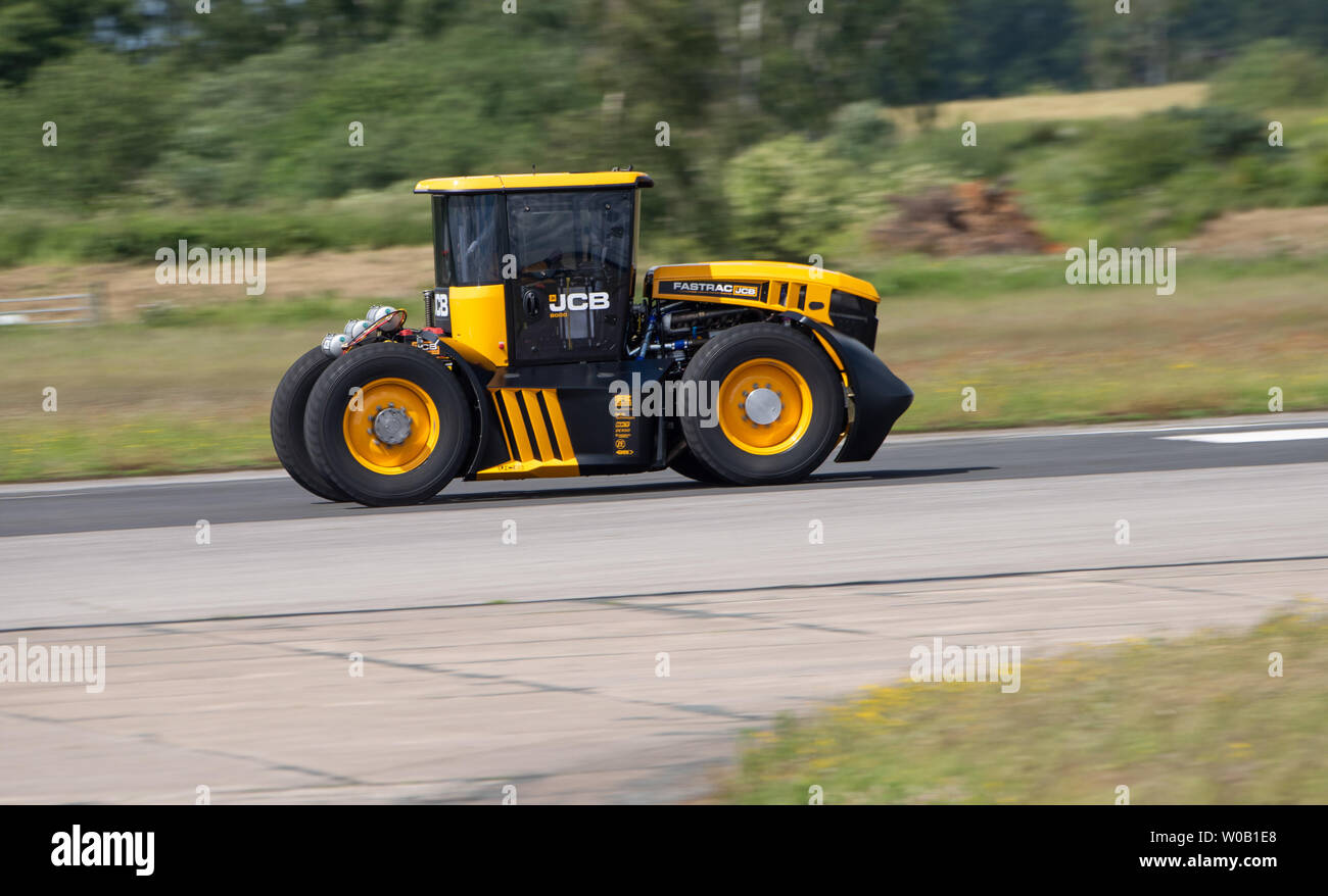 JCB Agri-machinery manufactures making a new British speed record for a tractor of 103.6 mph, beating the previous 87.27 mph record set in March 2018 Stock Photo