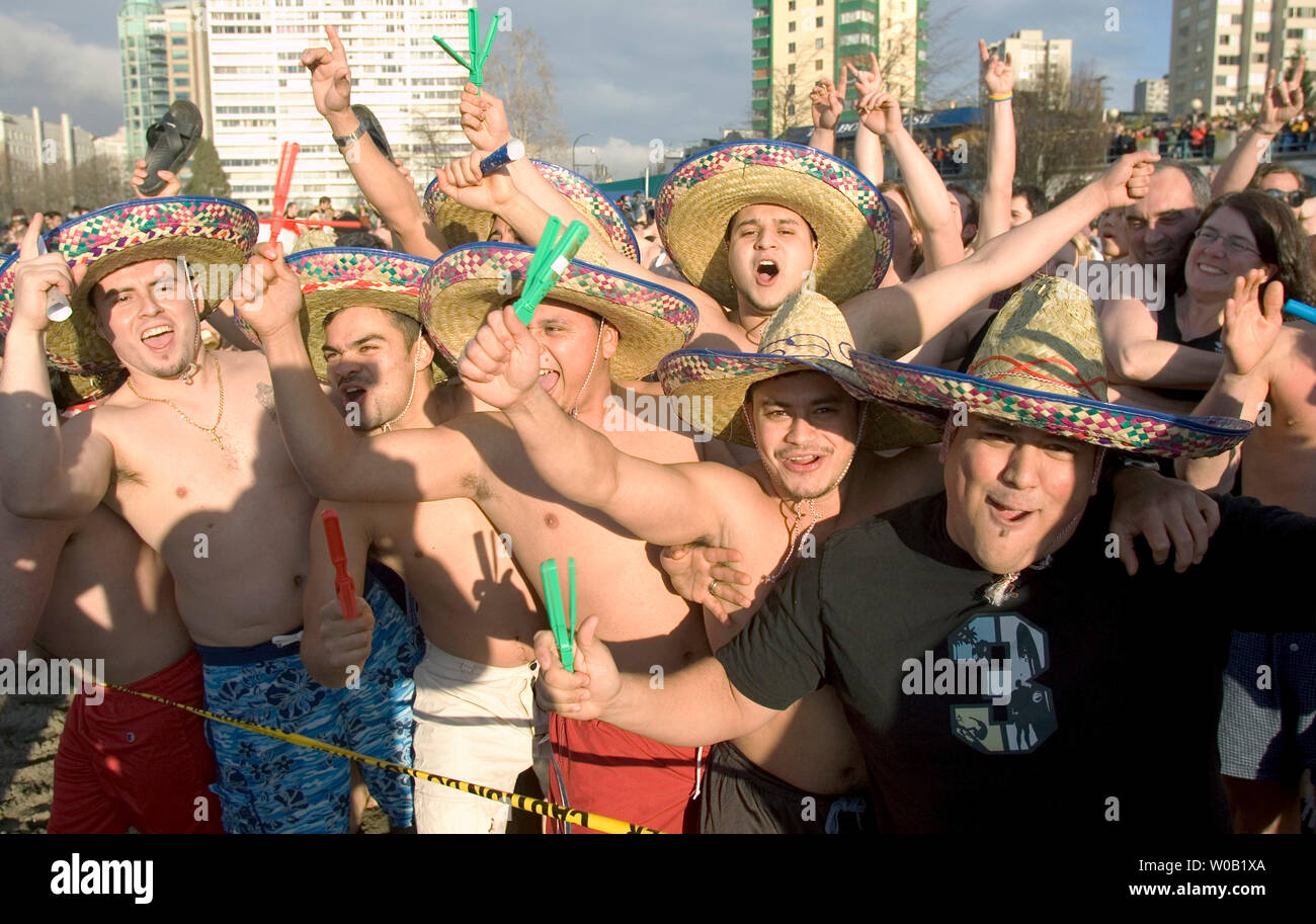Some two thousand New Years Day revelers, some in costume, about to brave the frigid waters of downtown Vancouver's English Bay during the 85th Annual Polar Bear Swim, January 1, 2005.   (UPI Photo/Heinz Ruckemann) Stock Photo