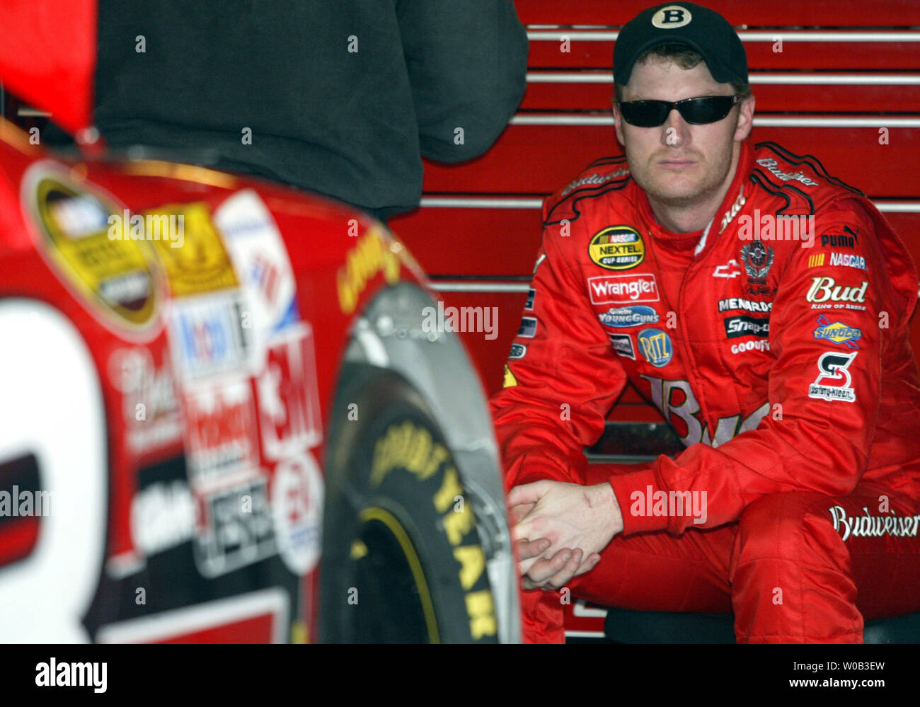 Nascar Race Car Driver Dale Earnhardt Jr Sits In His Garage As His Crew Works On The Race Car During Directv 500 Practice At The Martinsville Speedway In Martinsville Va On March