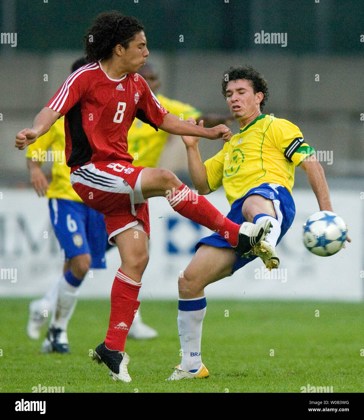 Canada's Cristian Nunez (L) and Ji Parana of Brazil go for the ball in the second half in a men's U20 soccer game at Vancouver's Swangard Stadium, May 25, 2006. Brazil wins 3-1. (UPI Photo/Heinz Ruckemann) Stock Photo