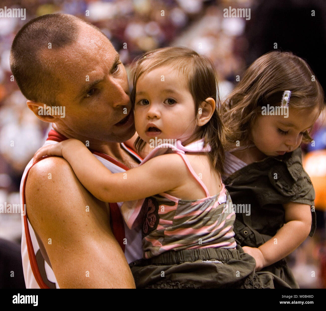 Two time NBA MVP Steve Nash holds his daughters Lourdes and Isabella (R) at his childrens charity classic all-star basketball game, at Vancouver's GM Place on July 22, 2006.  (UPI Photo/Heinz Ruckemann) Stock Photo