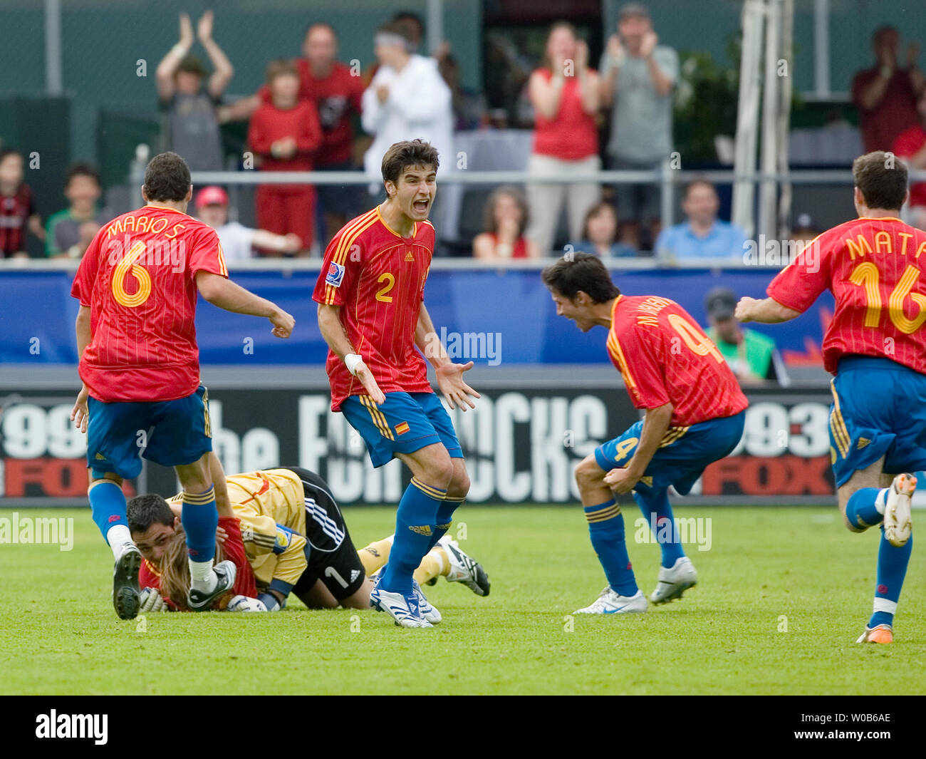 Spain's goalie Adan tackles the game tying goal scorer Diego Capel while teammates (L-R) Mario Suarez, Antonio Barragan , Marc Valiente, and Juan Manuel Mata celebrate during the second half of a 2007 FIFA U-20 World Cup soccer match against Uruguay at Swangard stadium in Burnaby, British Columbia,  July 1, 2007. The game ended in a 2-2 tie.  (UPI Photo/Heinz Ruckemann) Stock Photo