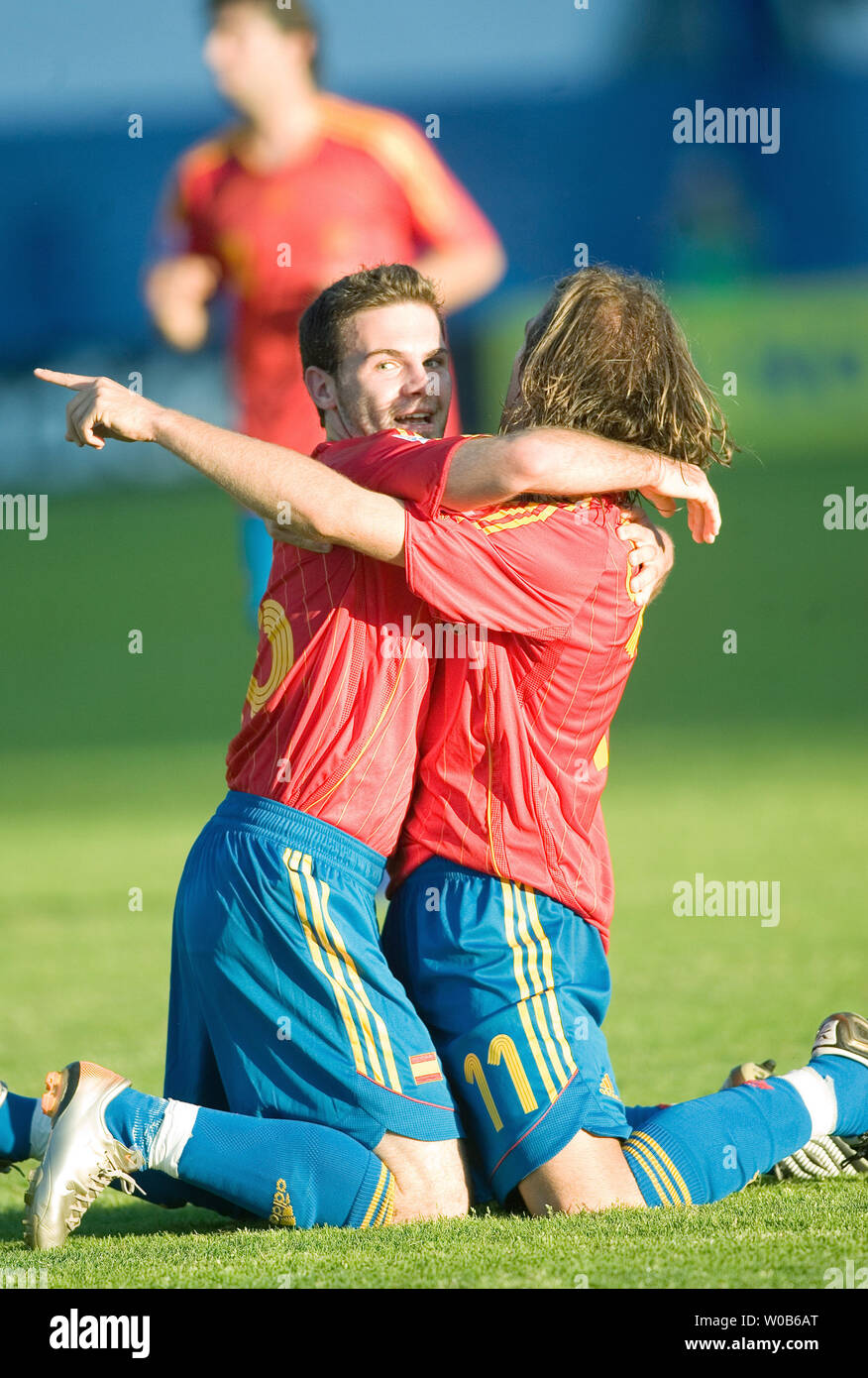 Diego Capel (R) celebrates with teammate Juan Manuel Mata after Mata scored his team's second goal against Zambia during the first half of a 2007 FIFA U-20 World Cup soccer match at Swangard stadium in Burnaby, British Columbia on July 4, 2007. Spain won 2-1.  (UPI Photo/Heinz Ruckemann) Stock Photo