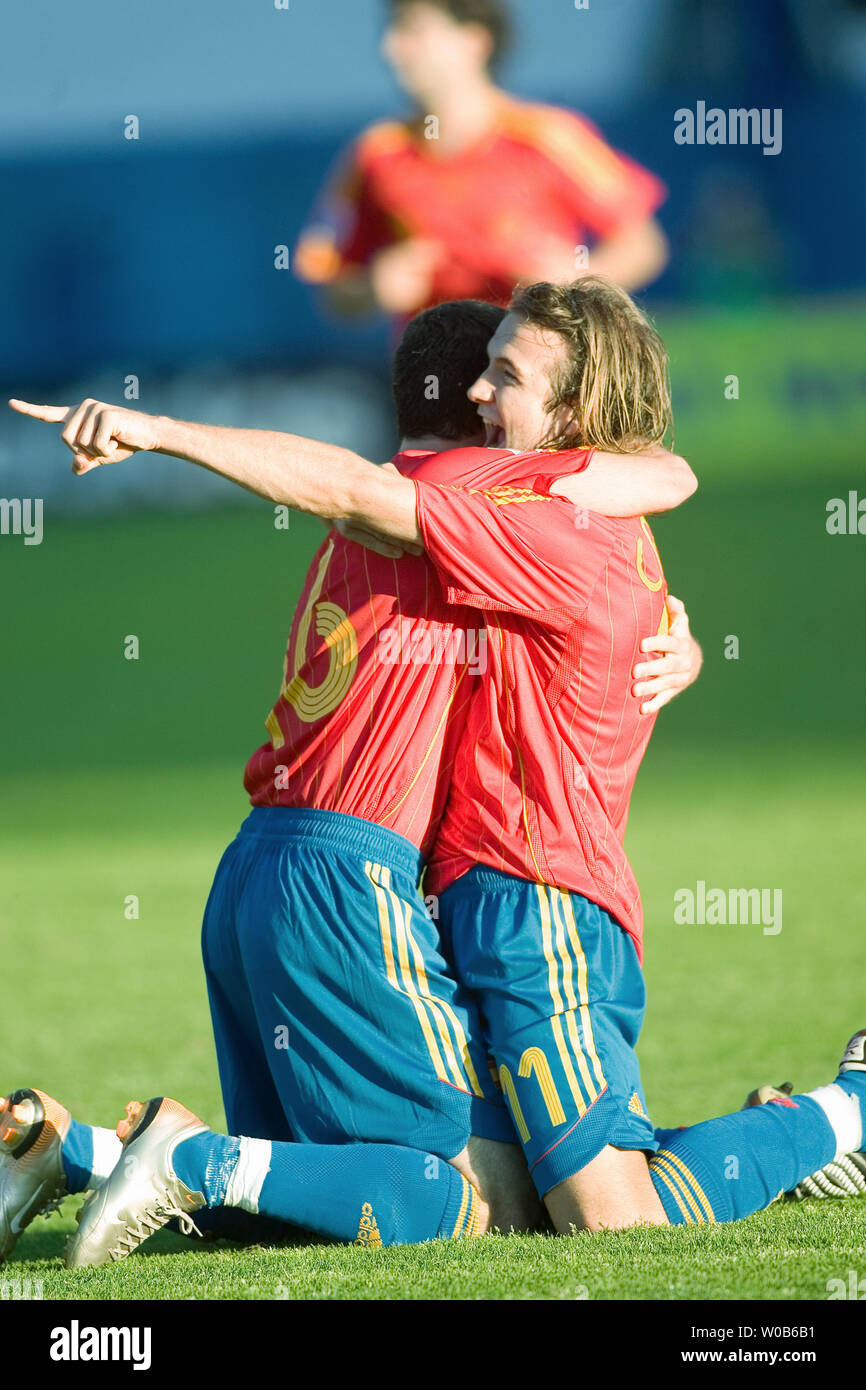 Diego Capel (R) celebrates with teammate Juan Manuel Mata after Mata scored his team's second goal against Zambia during the first half of a 2007 FIFA U-20 World Cup soccer match at Swangard stadium in Burnaby, British Columbia on July 4, 2007. Spain won 2-1.  (UPI Photo/Heinz Ruckemann) Stock Photo