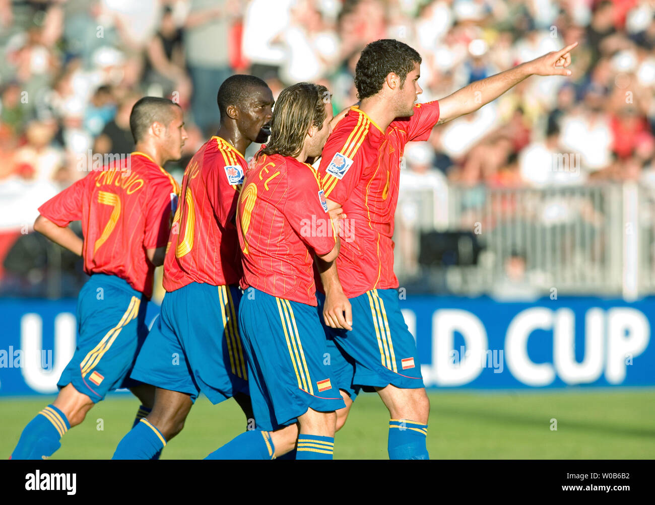 L-R) Spain's Toni Calvo, Sunny Stephen and Diego Capel celebrate teammate  Mario Suarez's first goal of the game against Zambia during the first half  of a 2007 FIFA U-20 World Cup soccer