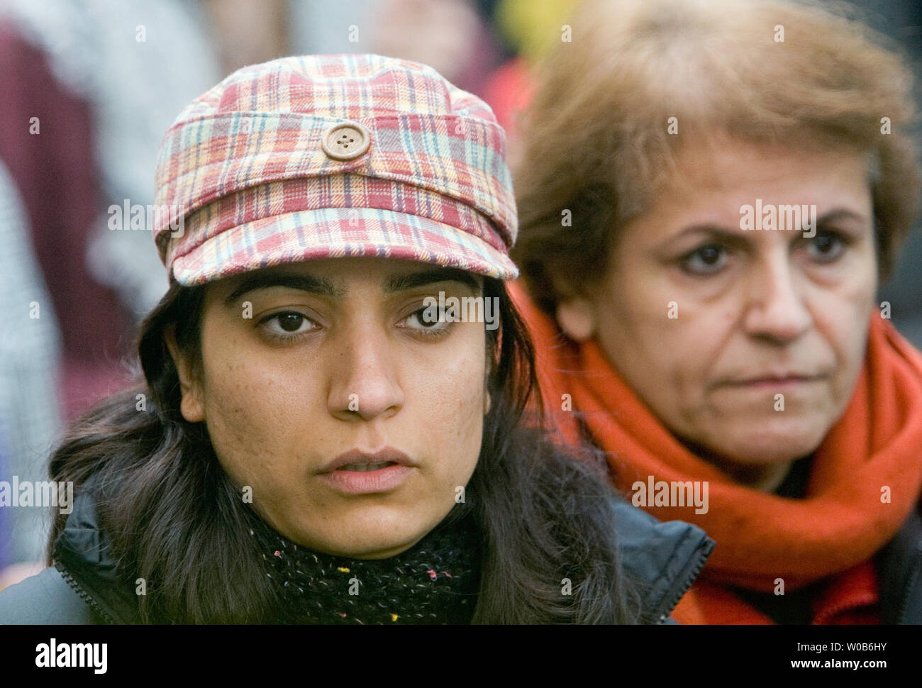 Malalai Joya (L) the 29-year old suspended member of the Afghan Parliament, the Wolesi Jirga, marches and speaks at a peace rally protesting Canada's continued military involvement in Afghanistan during her week long visit to Vancouver, British Columbia,October 27, 2007. Fighting for women's rights in her country Joya is an outspoken opponent of the domination of warlords and has survived four assasination attempts. Named by the BBC 'the most famous woman in Afghanistan', Joya is among five nominees named by the European Parliament for Sakharov Prize for Freedom of Thought, September 11, 2007. Stock Photo