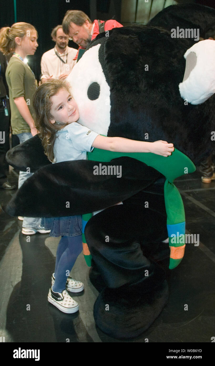 Four year old Dakota from Vancouver gets a hug from Miga at the unveiling of the 2010 Winter Olympic Mascots Miga, Quatchi and Sumi in Surrey near Vancouver, British Columbia, November 27, 2007. Miga is a sea bear which according to First Nations legend is an orca whale which can turn into the rare white Kermode bear only found in British Columbia. Quatchi is a sasquatch described in many West Coast First Nations stories but rarely seen. Sumi is an animal gaurdian spirit who wears the hat of an orca, has the strong leags of the black bear and flies with the wings of the great thunderbird.  (UP Stock Photo