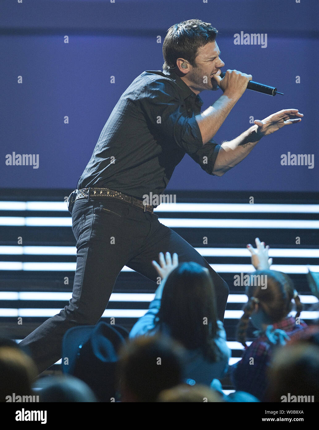 Emerson Drive lead singer Brad Mates performs with his band onstage