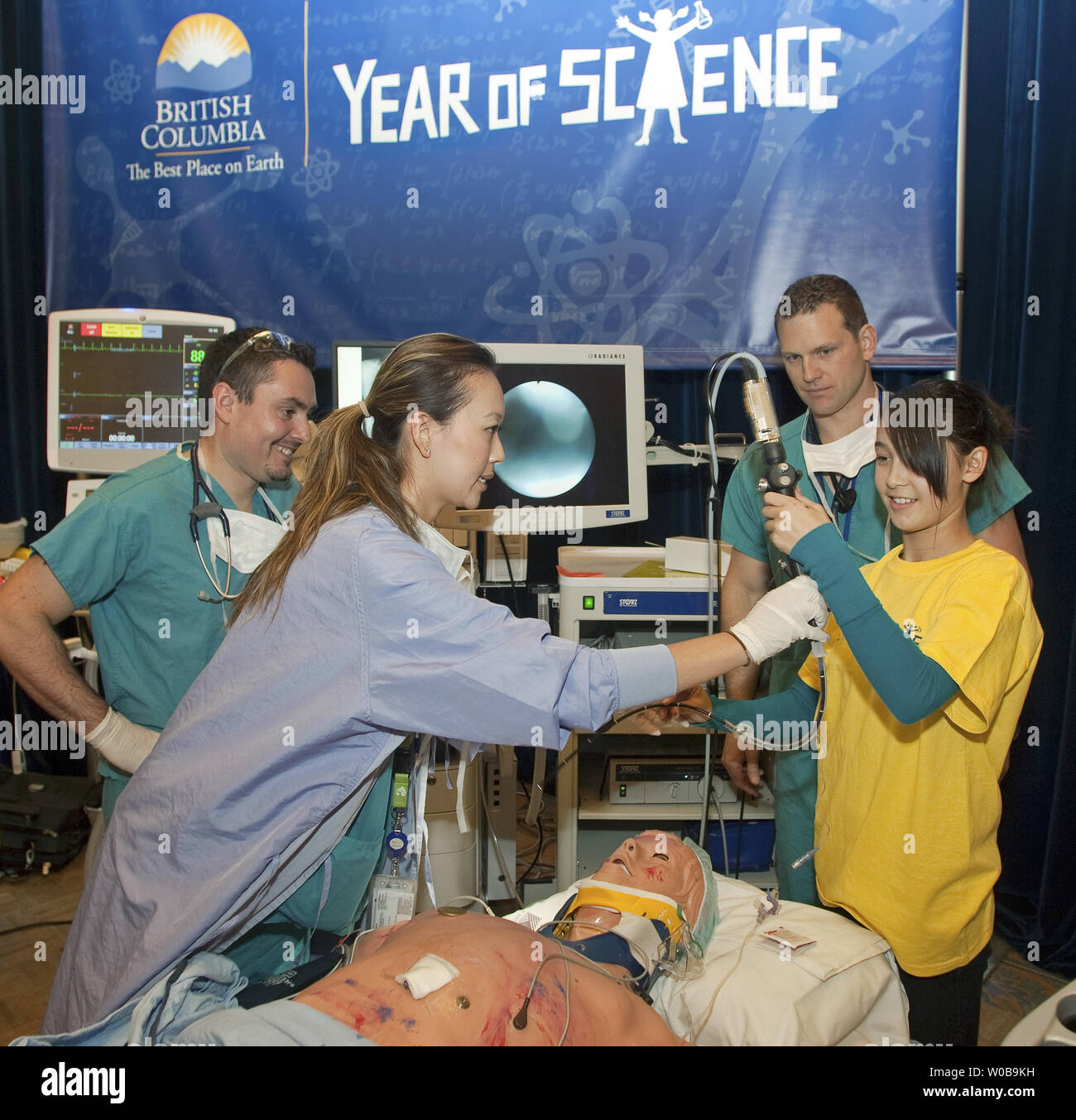 High school students interact with doctors and technicians demonstrating new technology including iPad and iPhone applications being used in an Emergency Room trauma simulation during the official opening of the two day Year of Science, Science and Health Expo at the Fairmont Waterfront Hotel in downtown Vancouver, BC, on November 25, 2010. The Expo hopes to inspire high school students to choose careers in health sciences and bio technology.   UPI/Heinz Ruckemann Stock Photo